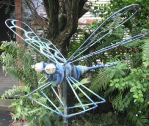 Dragonfly sculpture made from car parts