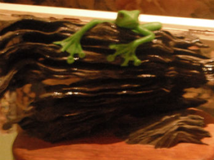 Frog on a log sculpture
